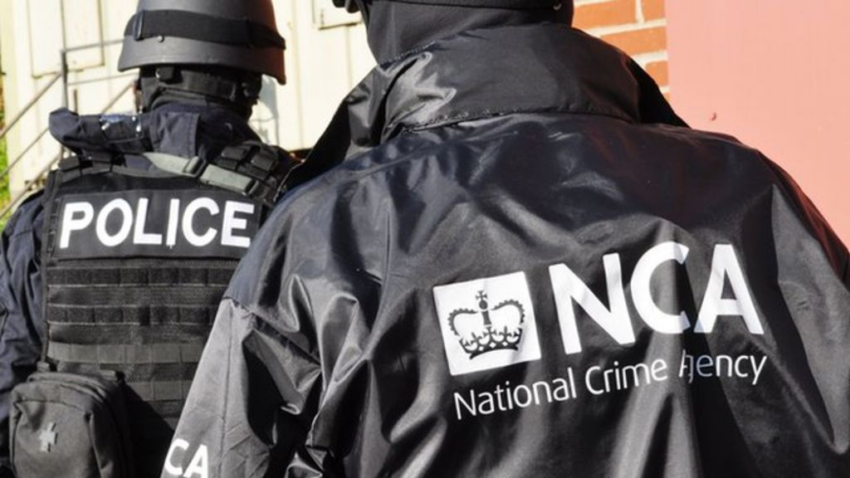 Officers from Britain's National Crime Agency.